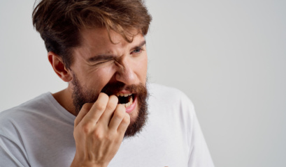 A man experiencing a dental emergency.