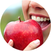 Woman Eating Apple With Sensitive Teeth