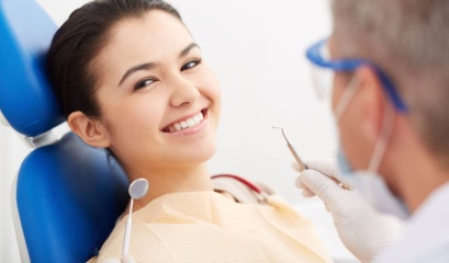Woman Smiling After Dentist Visit For Bad Breath