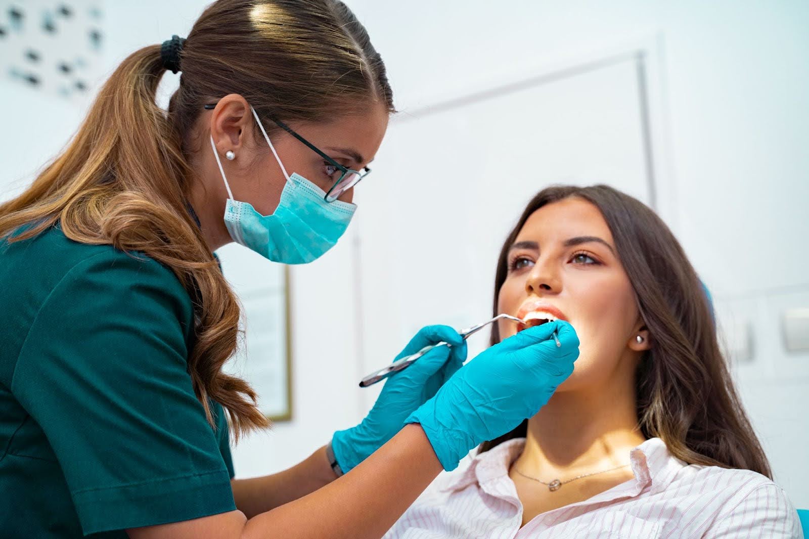 A Dentist Checking The Patient’s Chipped Teeth