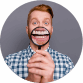 A Man With A Magnifying Glass Showing His Teeth